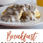 breakfast sausage gravy on biscuit with glass of milk