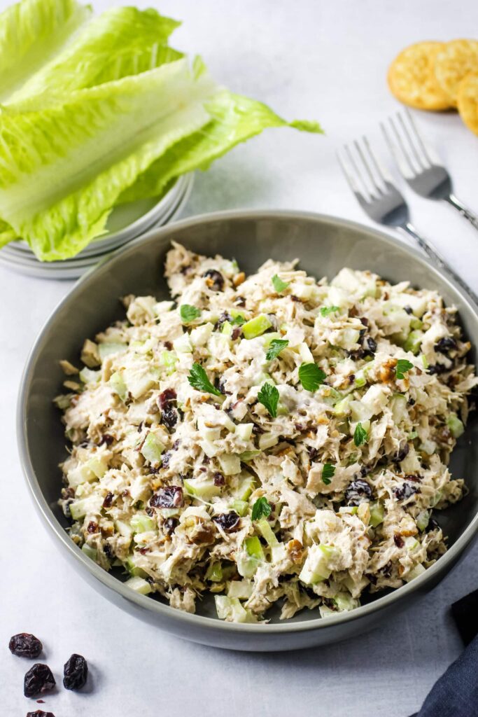 sweet tuna salad in bowl with forks and lettuce to wrap around salad