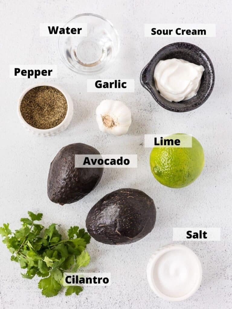All of the ingredients for Creamy Avocado Sauce in separate bowls.
