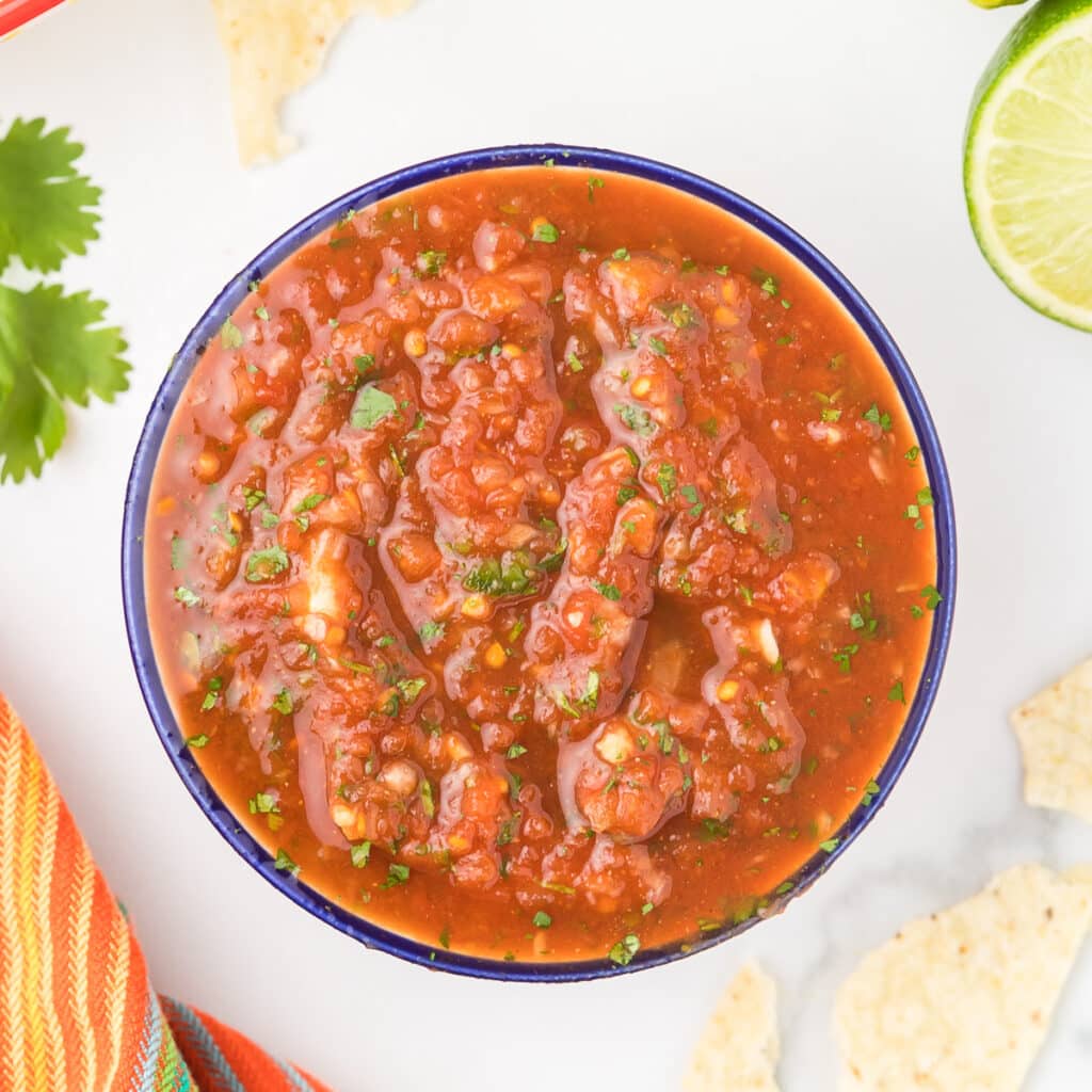 Tomato Jalapeno Salsa in a bowl with chips.