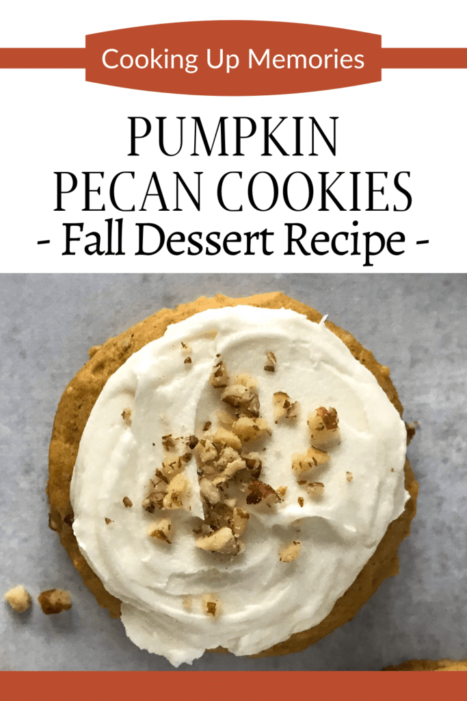 One pumpkin cookie with icing and pecans.