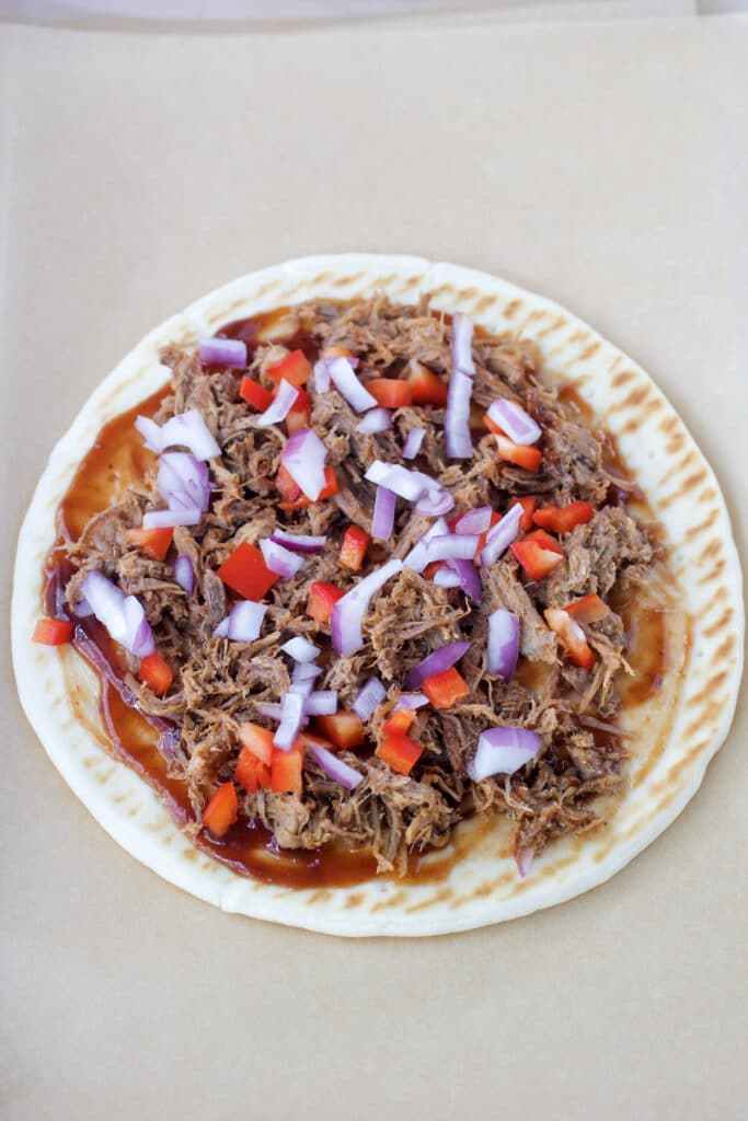 Flatbread layered with BBQ Sauce, pulled pork, onions and peppers