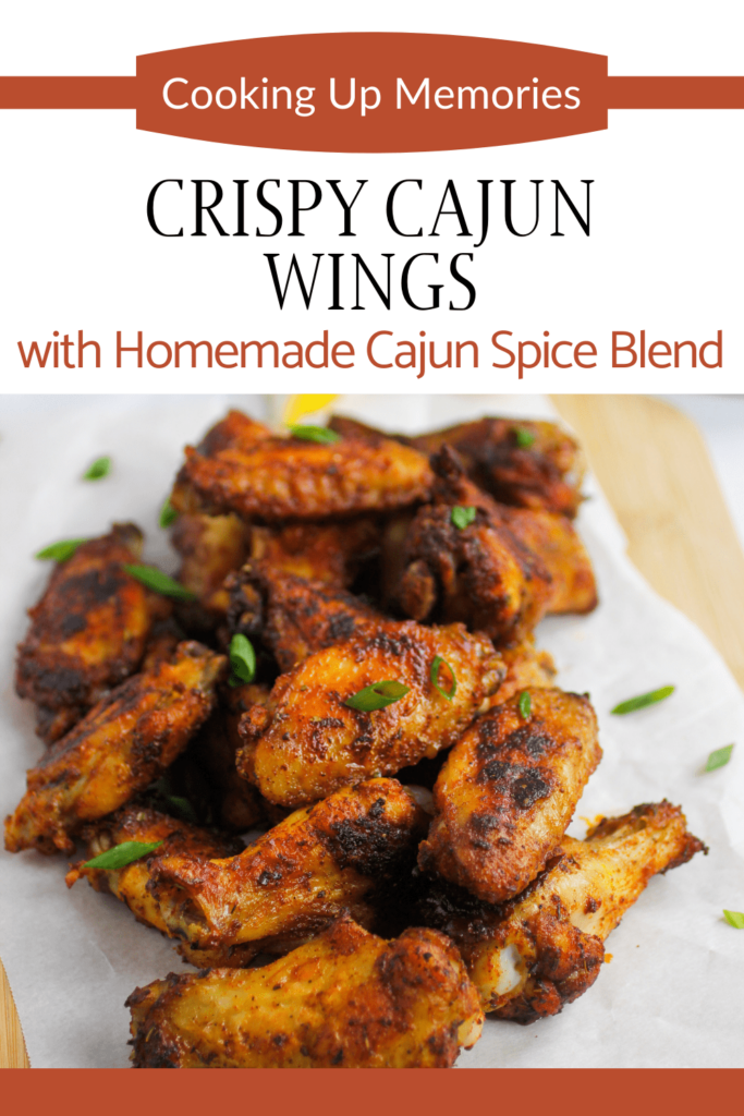 cajun wings on parchment paper with pinterest text