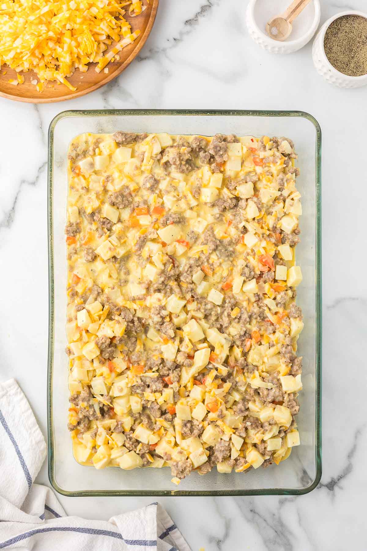 Egg mixture in a casserole dish before baking.