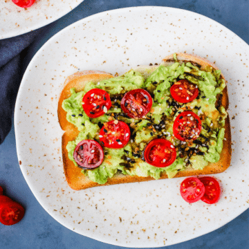 Avocado Toast with tomatoes and balsalmic glaze.