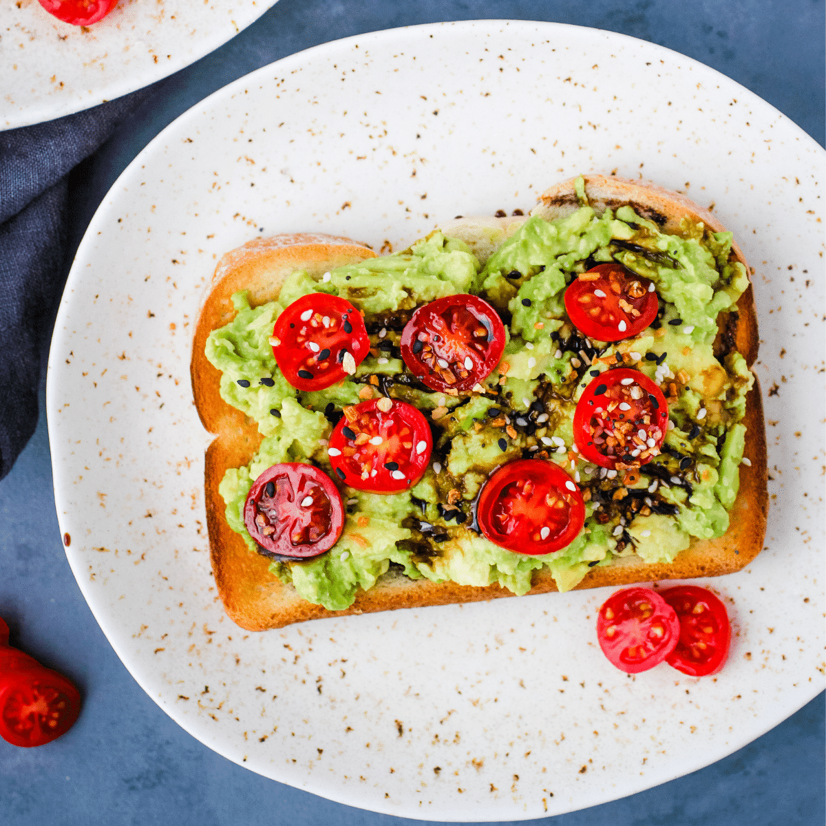Avocado Toast with tomatoes and balsalmic glaze.