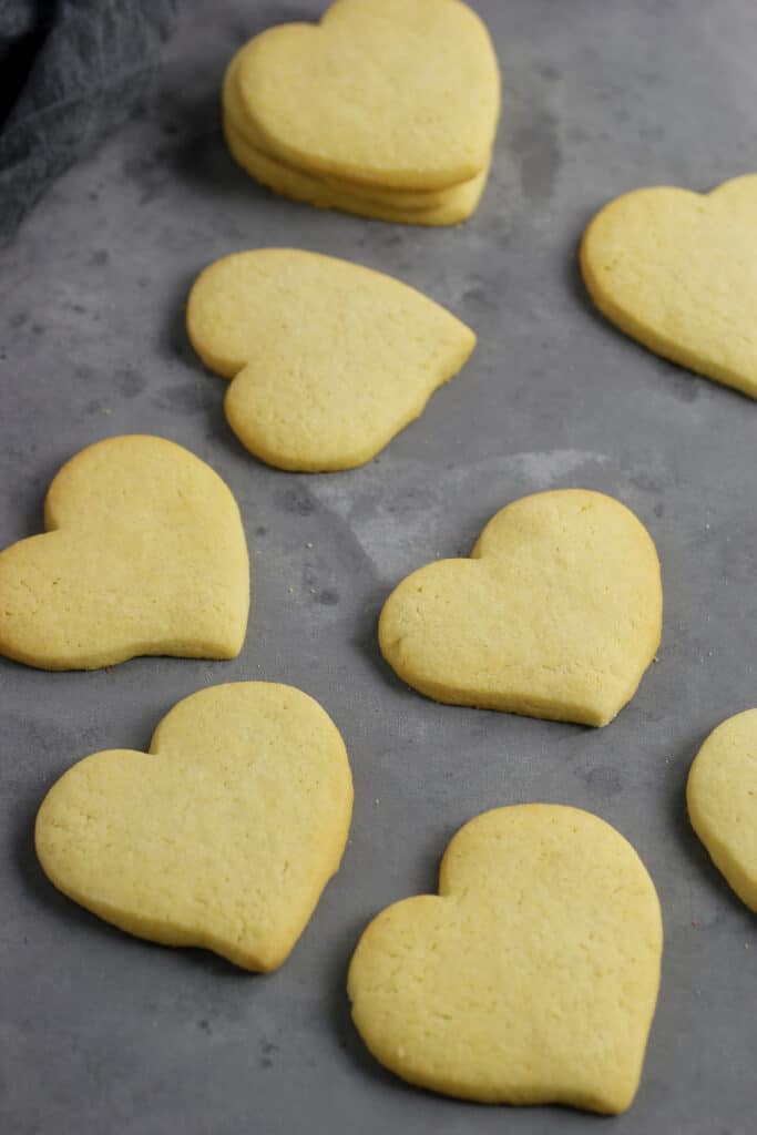 heart shaped sugar cookies on a blue gray back ground