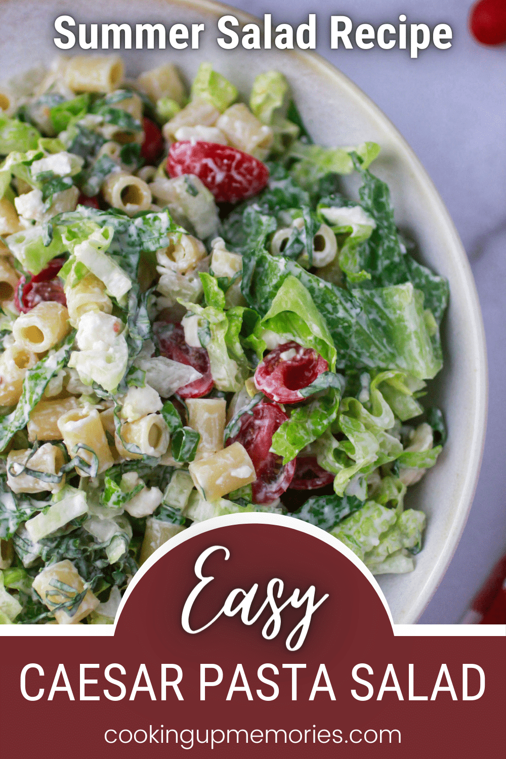 Caesar pasta salad in a white bowl.