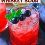 Cherry Whiskey Sour with basil and cocktail cherries