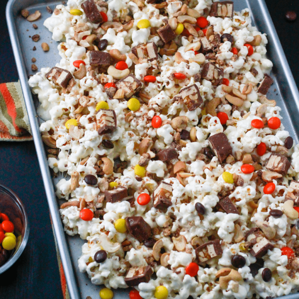 Halloween Popcorn Mix on a cookie sheet.