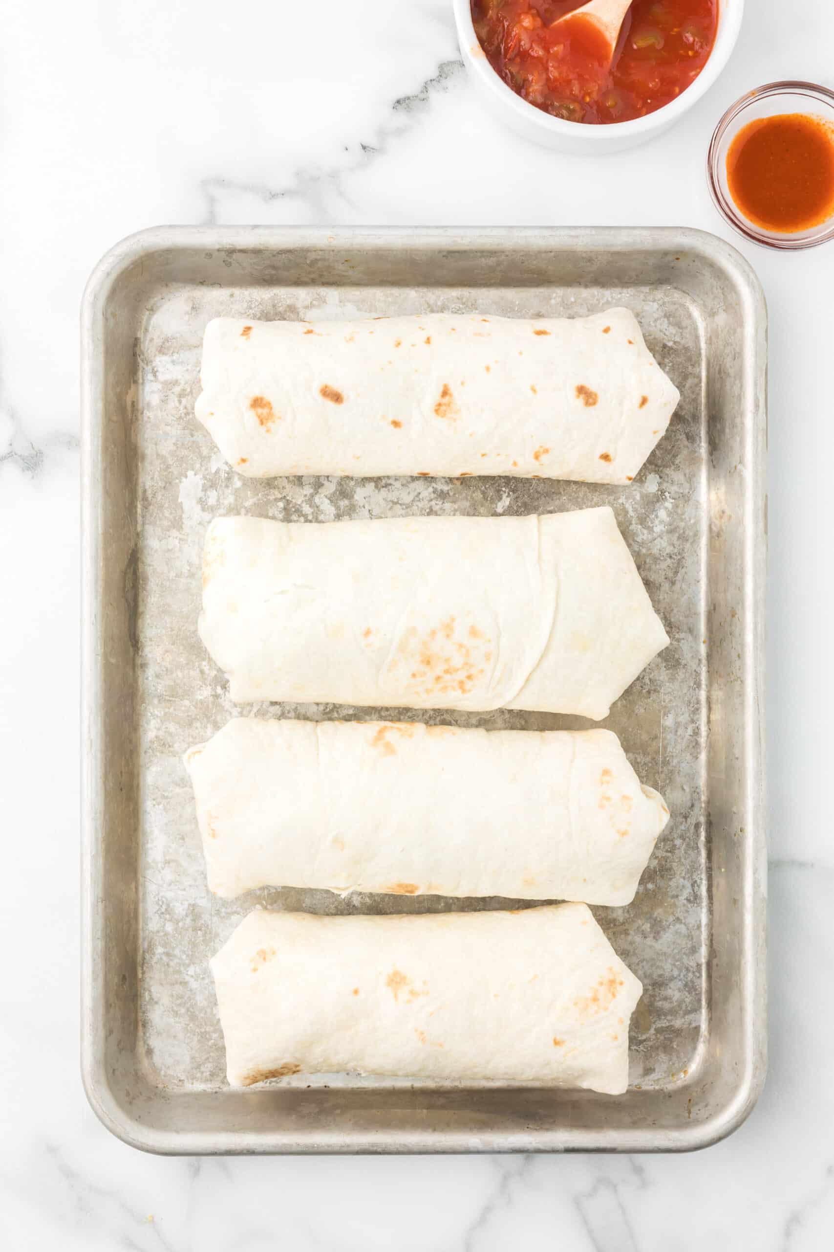 Breakfast Burritos on a sheet pan.