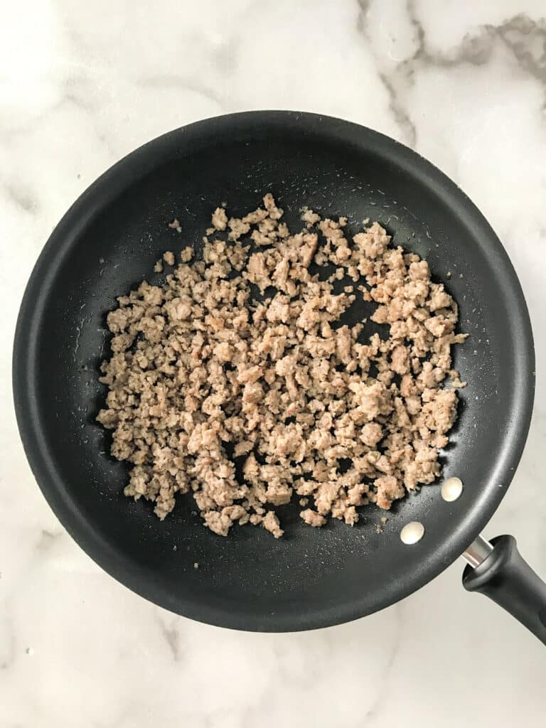 Sausage for Breakfast Burritos in a non stick skillet.