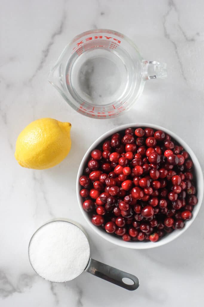 Lemon, water, cranberries and sugar to make Cranberry Simple Syrup.