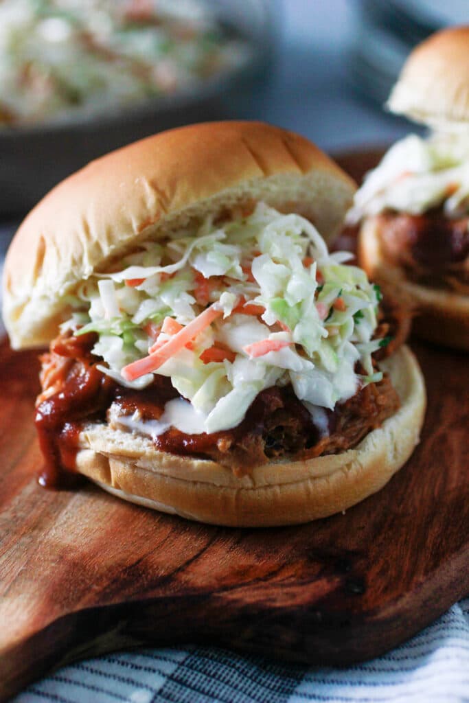 Sweet Creamy Cole slaw on top of Instant Pot Pulled pork and a bun.
