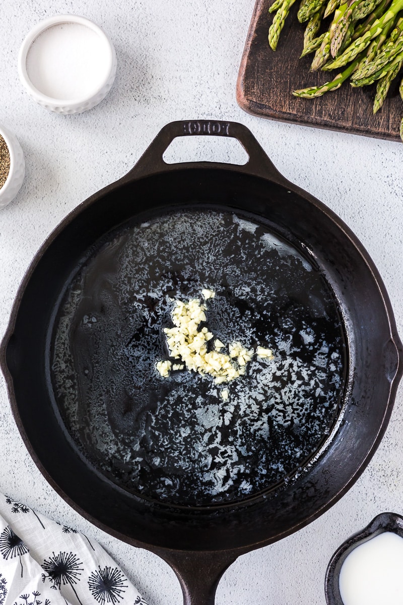 Cast iron skillet with butter and garlic.
