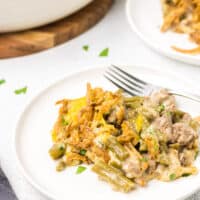 Green Bean Casserole with ground beef on a white plate.