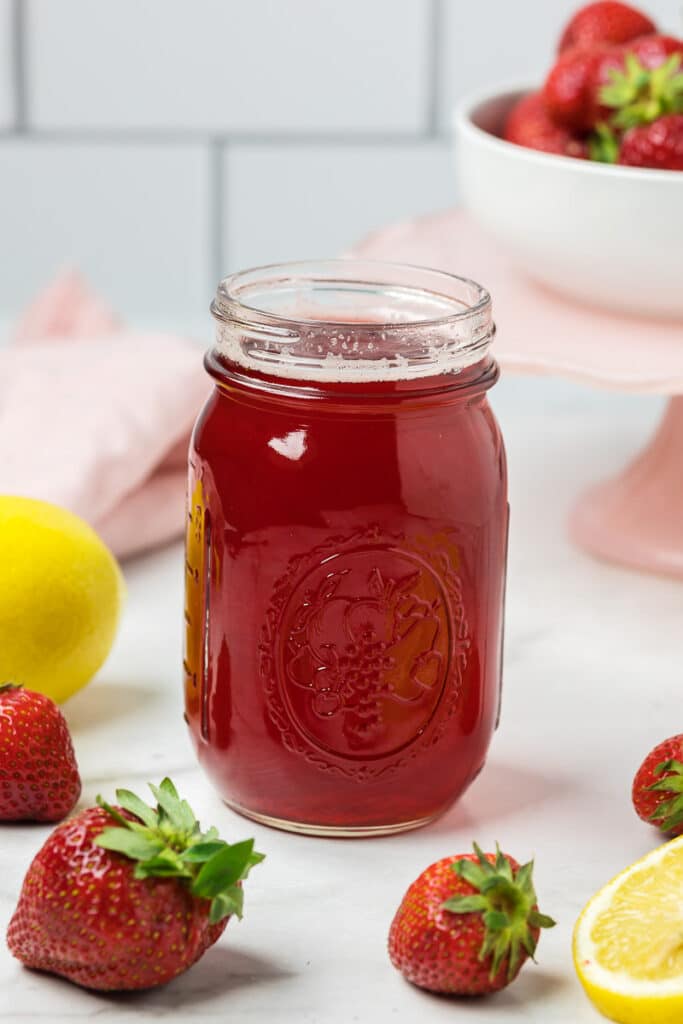 Strawberry Simple syrup in a jar.