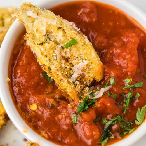 Air Fryer Artichoke Hearts in bowl of red sauce