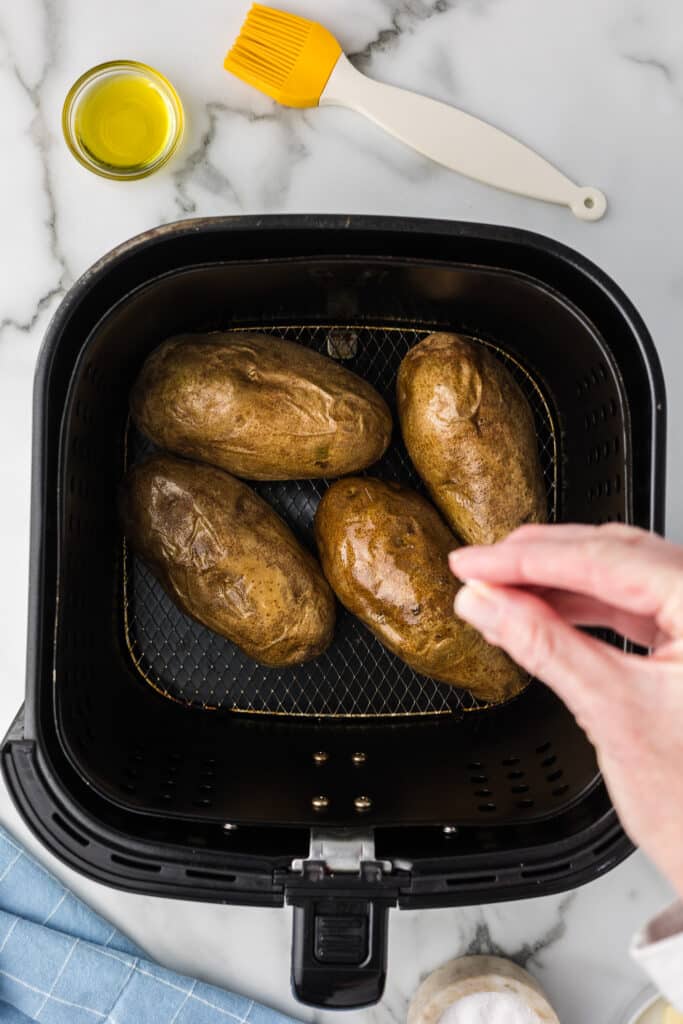 Cooked potatoes in air fryer with salt.