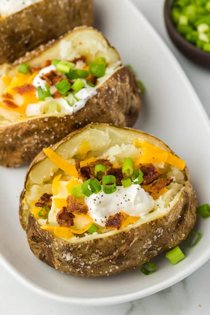 Air Fryer Loaded Baked Potato on a plate.