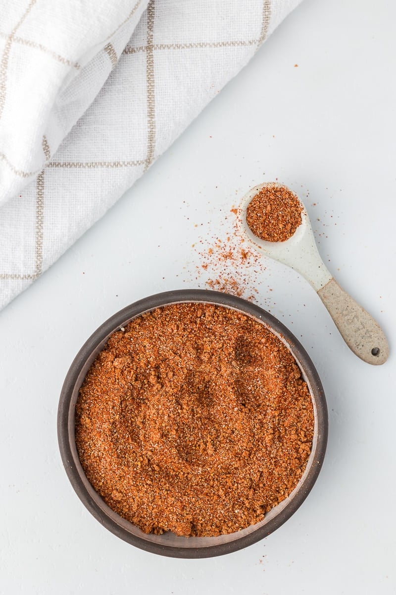 BBQ Spice Rub in a bowl with a teaspoon.