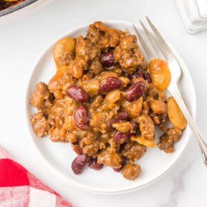 BBQ Baked Beans with ground beef on a white plate.