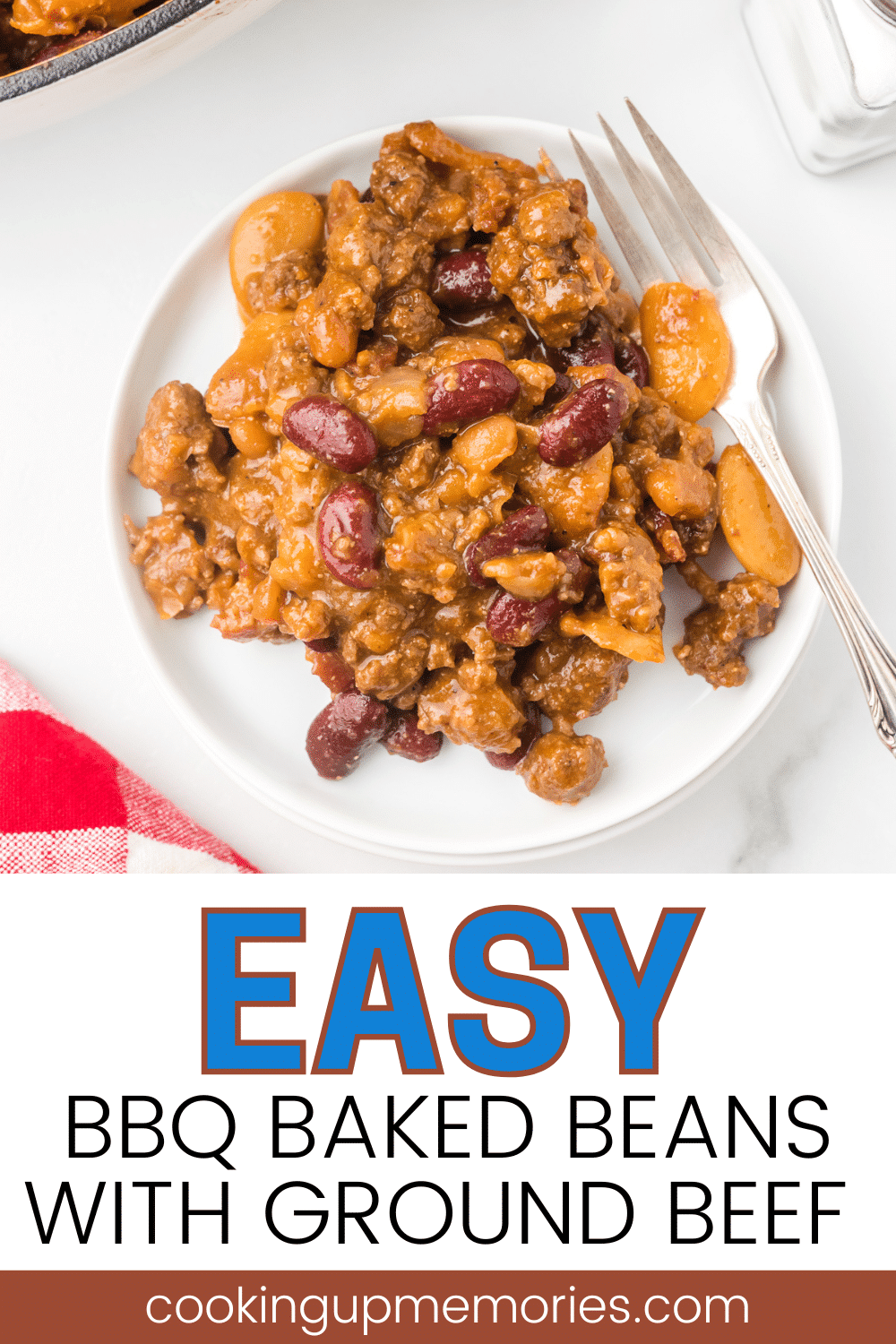 BBQ Baked Beans with Ground Beef on a plate with a fork.