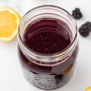Blackberry simple syrup in a jar.