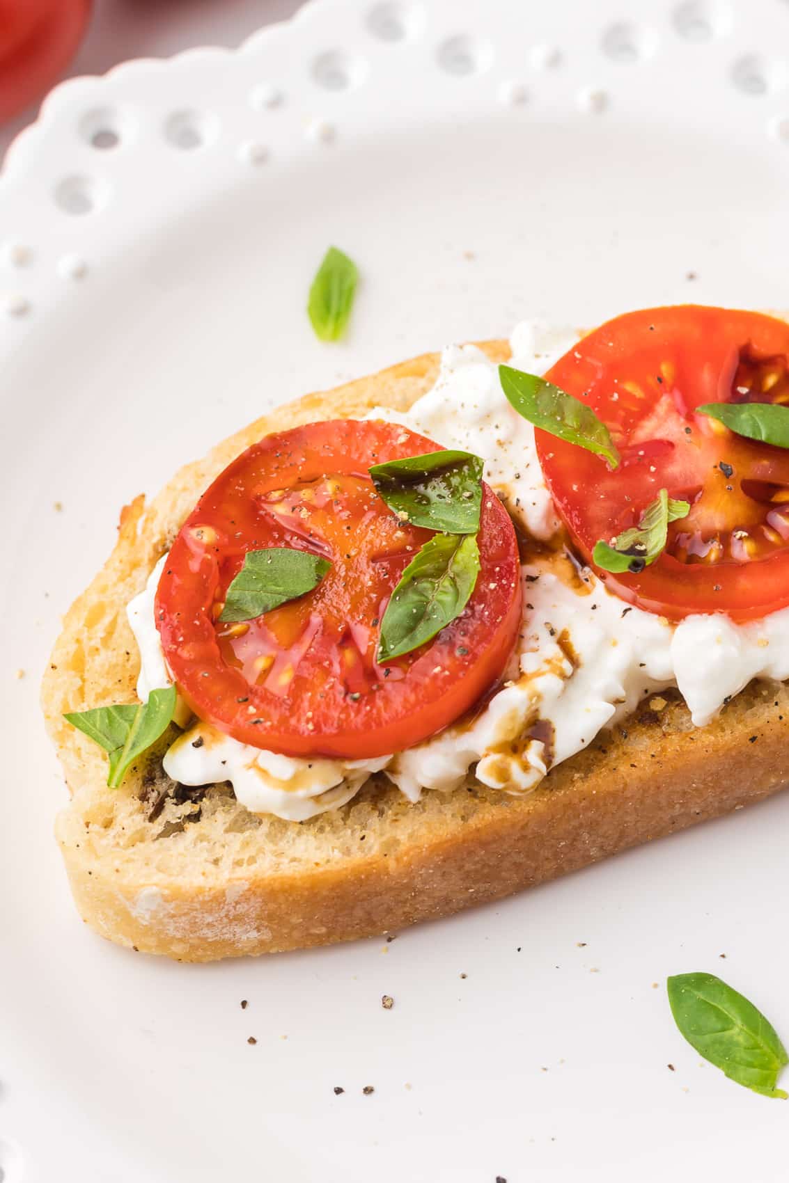 Cottage Cheese Toast with tomatoes, basil and balsamic glaze.