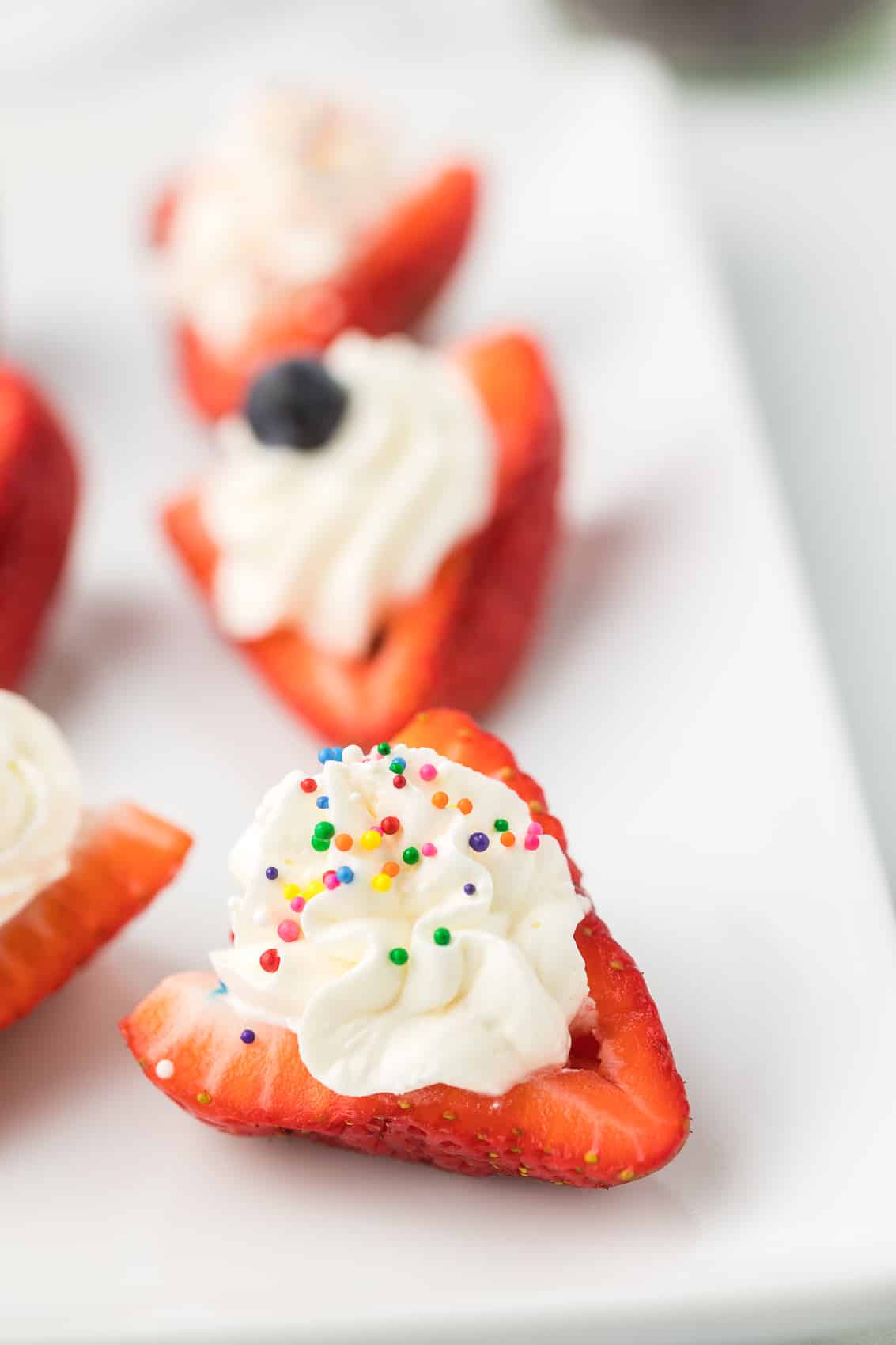 Deviled Strawberries on a white serving dish.