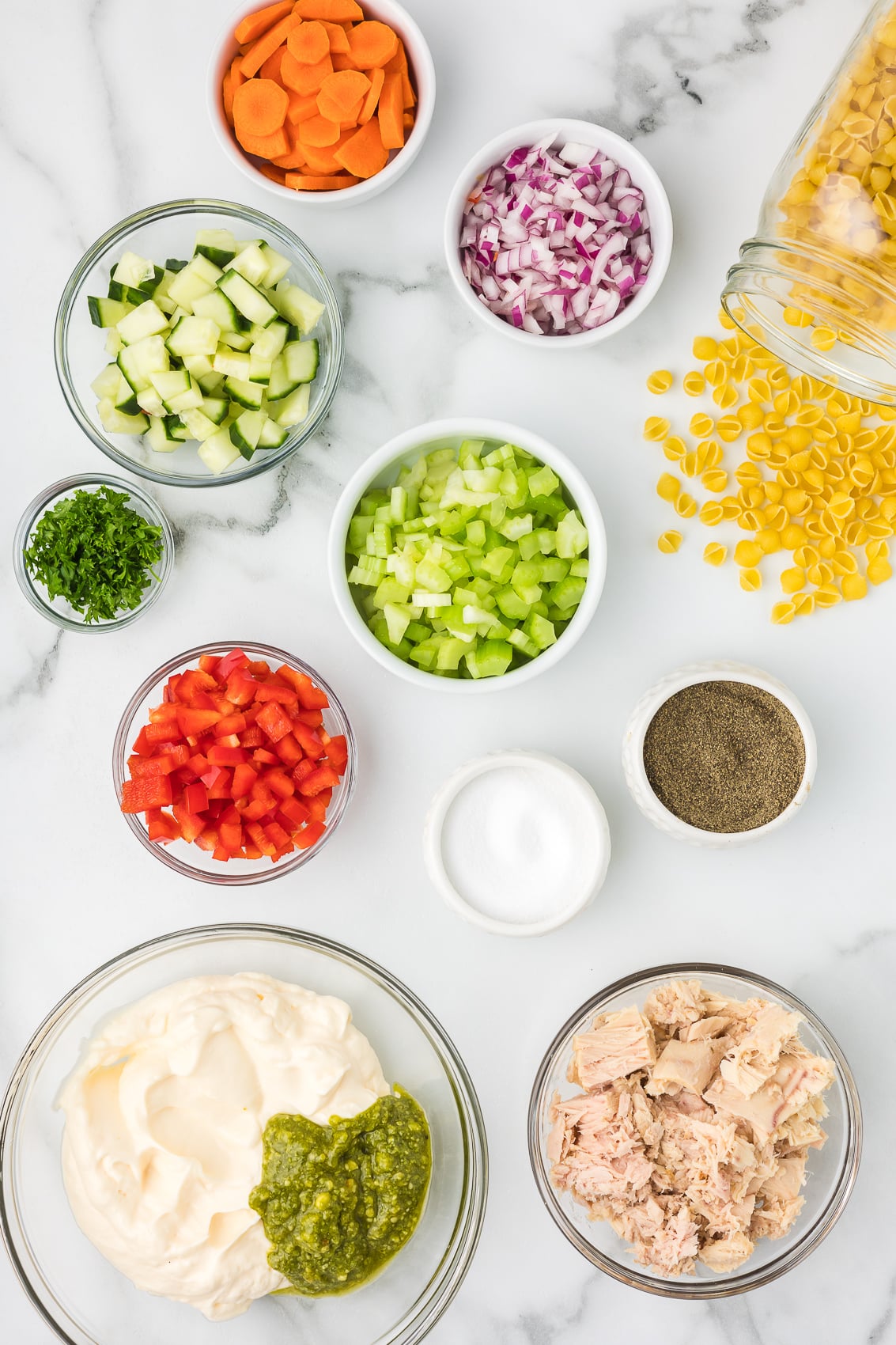 Ingredients on the countertop to make Pesto Pasta Tuna Salad.