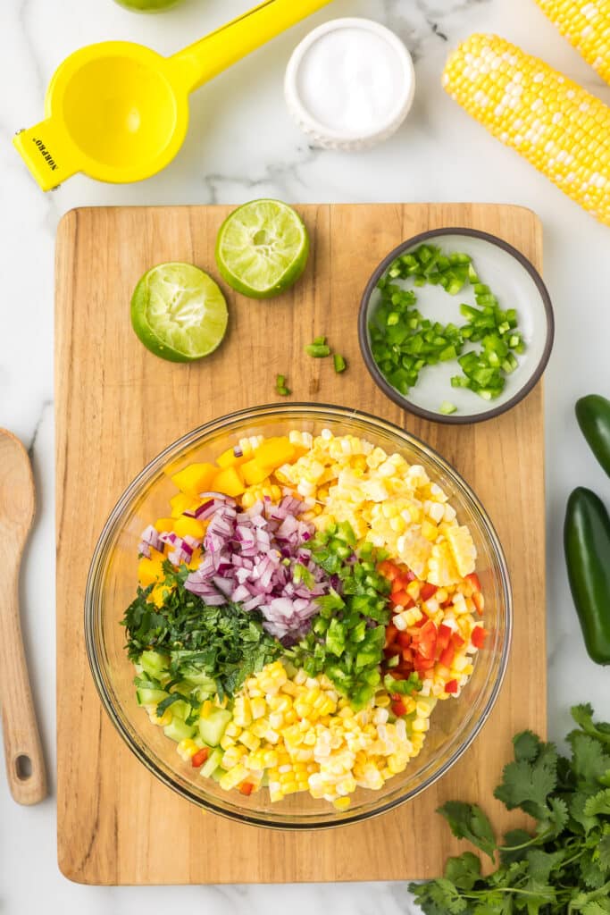 Ingredients in a bowl to make mango salsa.