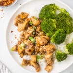 Spicy Teriyaki Chicken with broccoli and rice on a white plate.