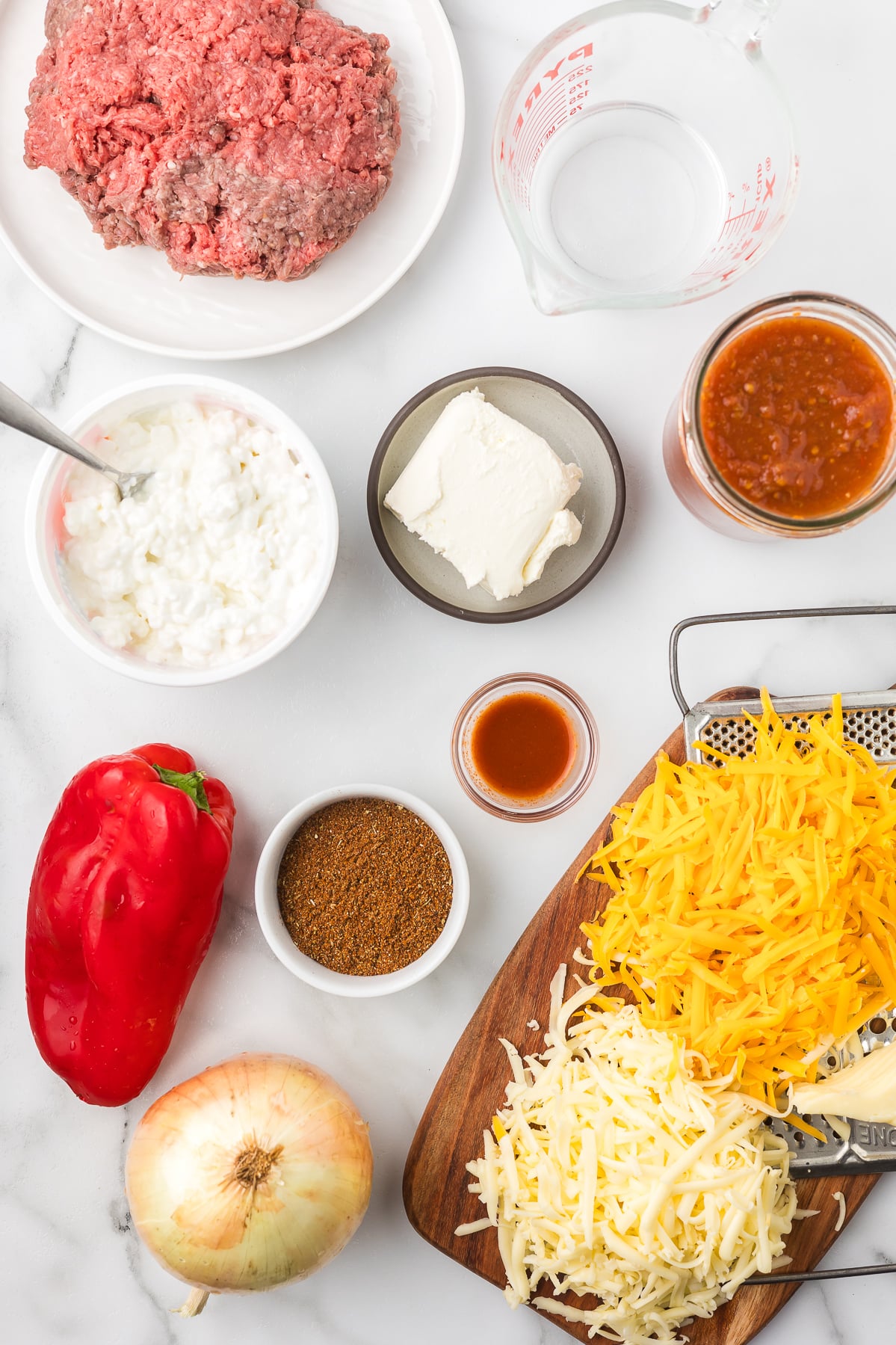 Ingredients to make hot taco dip with cottage cheese.