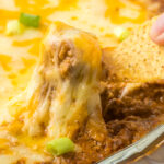 Taco Dip on a tortilla chip.
