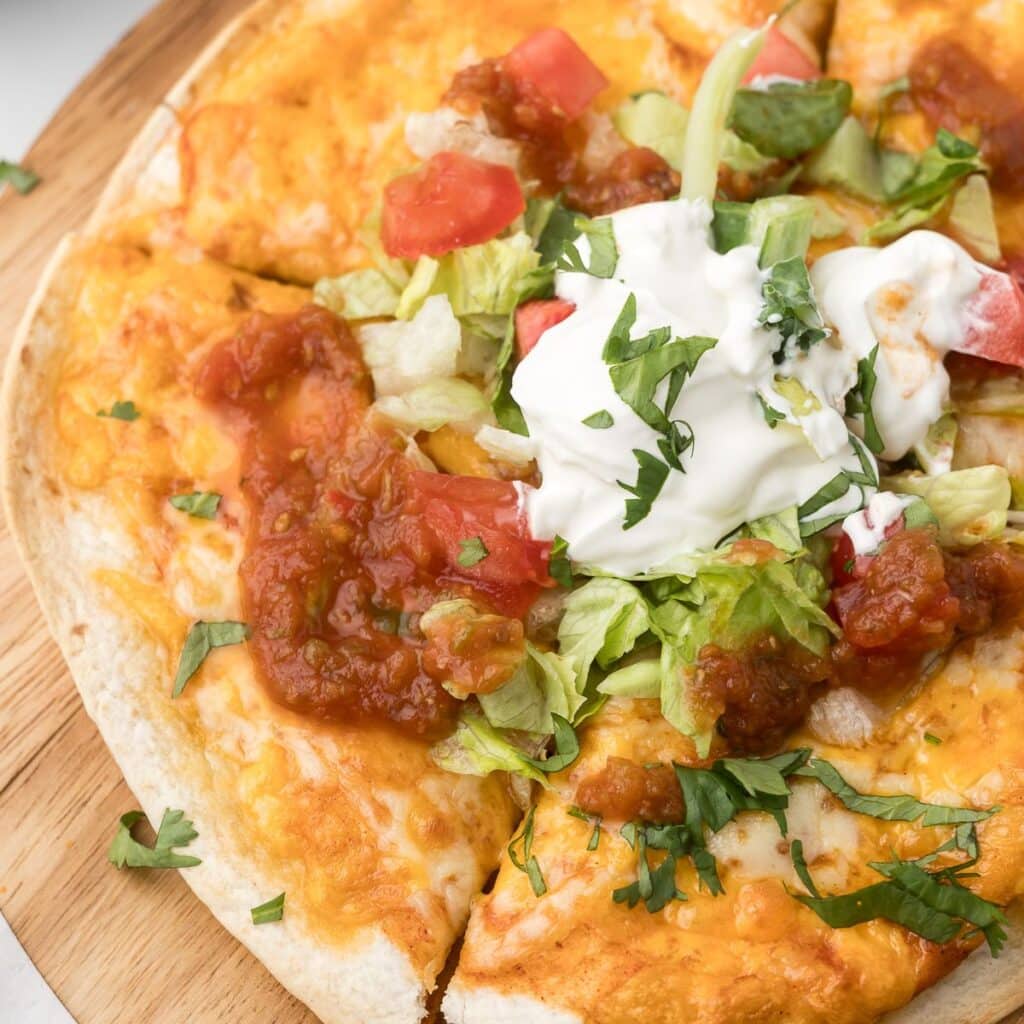 Air Fryer Mexican Pizza on a cutting board.