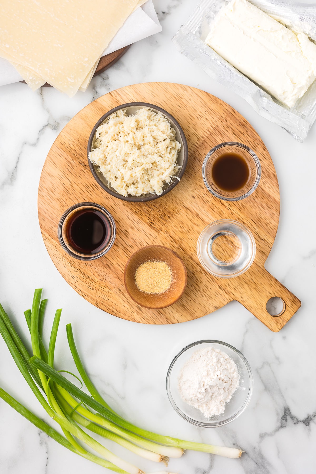 Ingredients on a table to make crab rangoon.