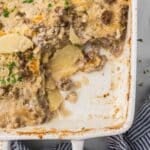 Hamburger Potato Stroganoff in a casserole dish with one piece removed.