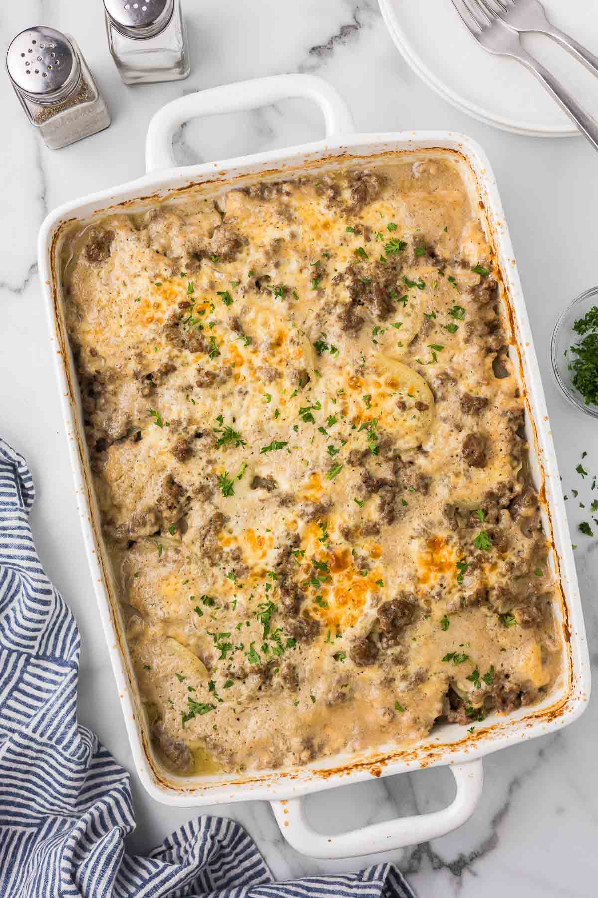 Hamburger Potato Stroganoff in a white casserole dish.