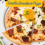 Yummy Breakfast Pizza on tortilla with cheese, sauce, bacon, and egg