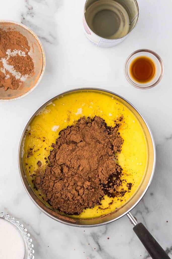 All the ingredients in a sauce pan to make hot fudge sauce.