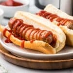 Air Fryer Italian Sausage on a bun with ketchup.