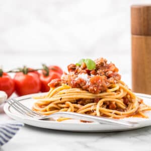 Spaghetti Chicken Bolognese Sauce on a plate with a fork.