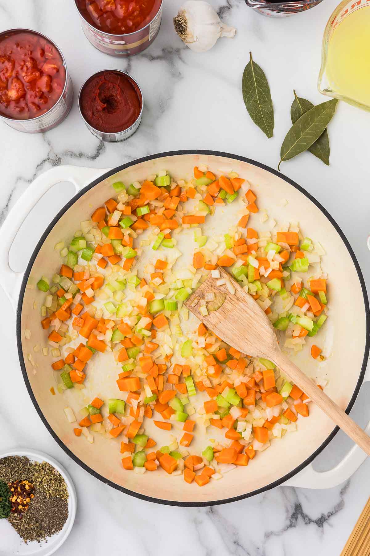 Diced carrots, celery and onion in a pan to saute.