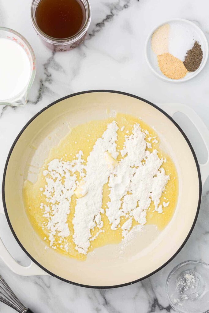 Melted butter with flour added to a dutch oven.