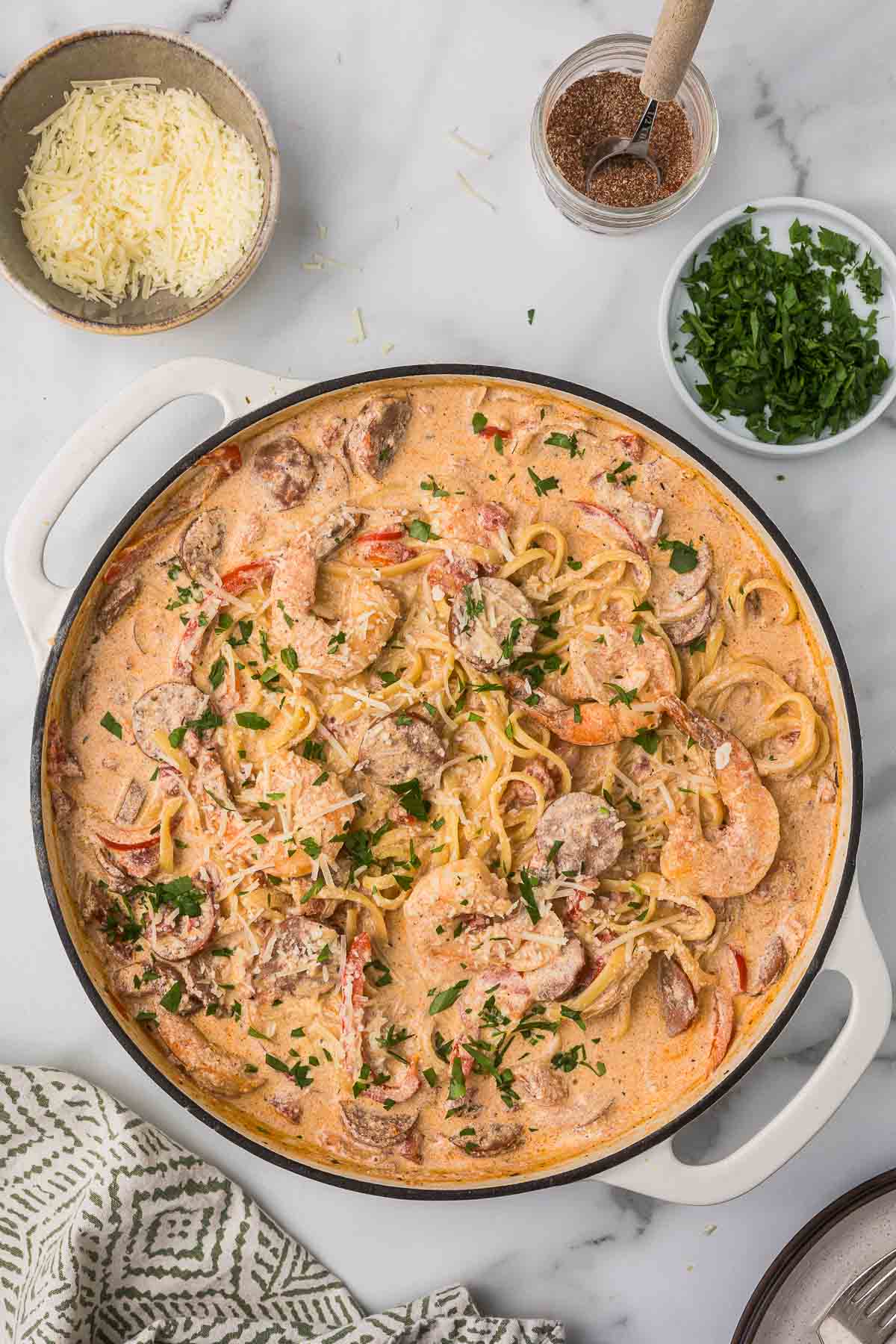Creamy Cajun pasta with sausage and shrimp in a pan before serving.  