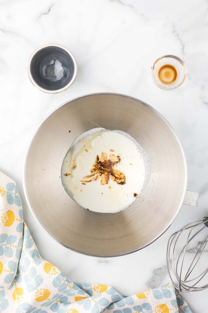 Heavy Cream, sugar and vanilla in a mixing bowl.