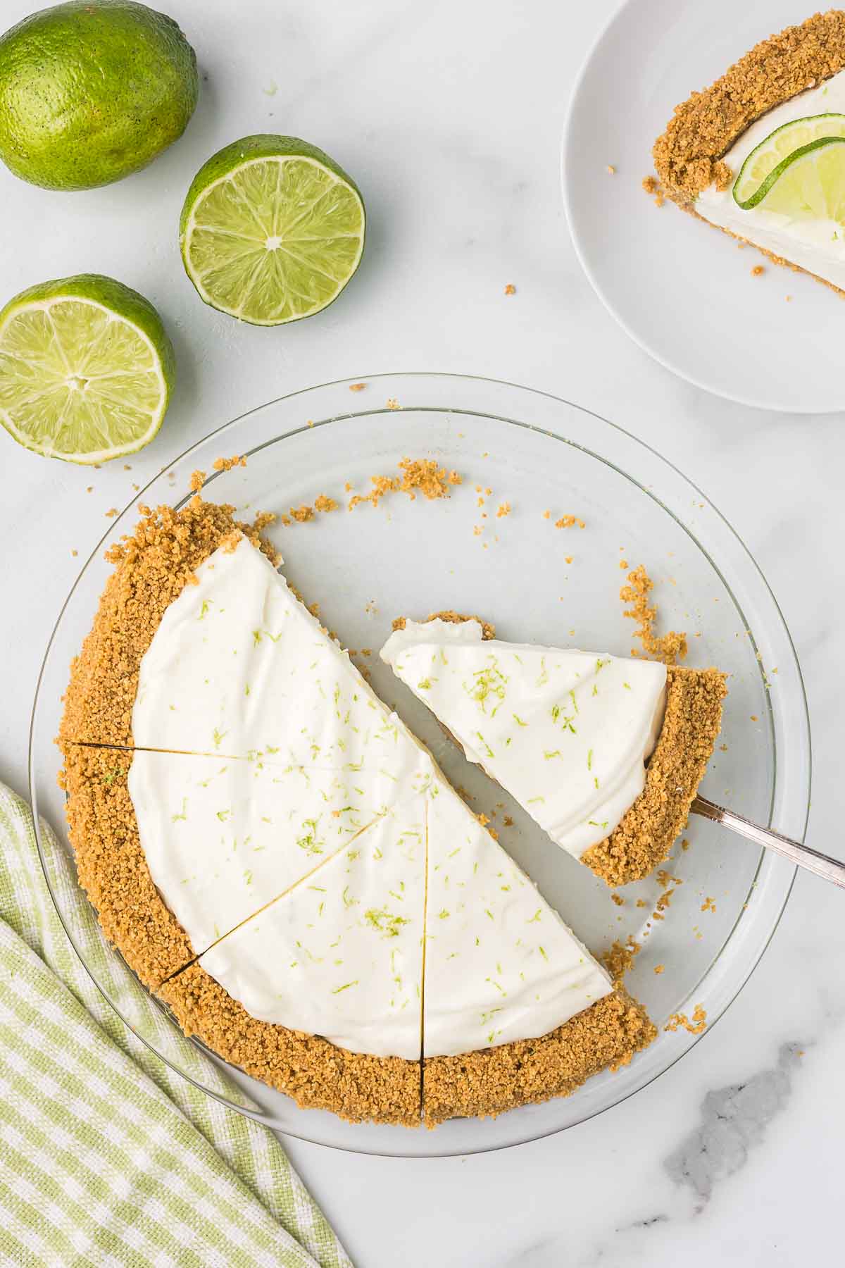 Key Lime pan slice in a white pie pan.