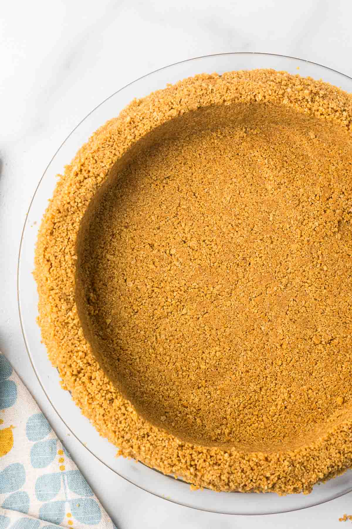 Graham Cracker crust in a clear pie pan.