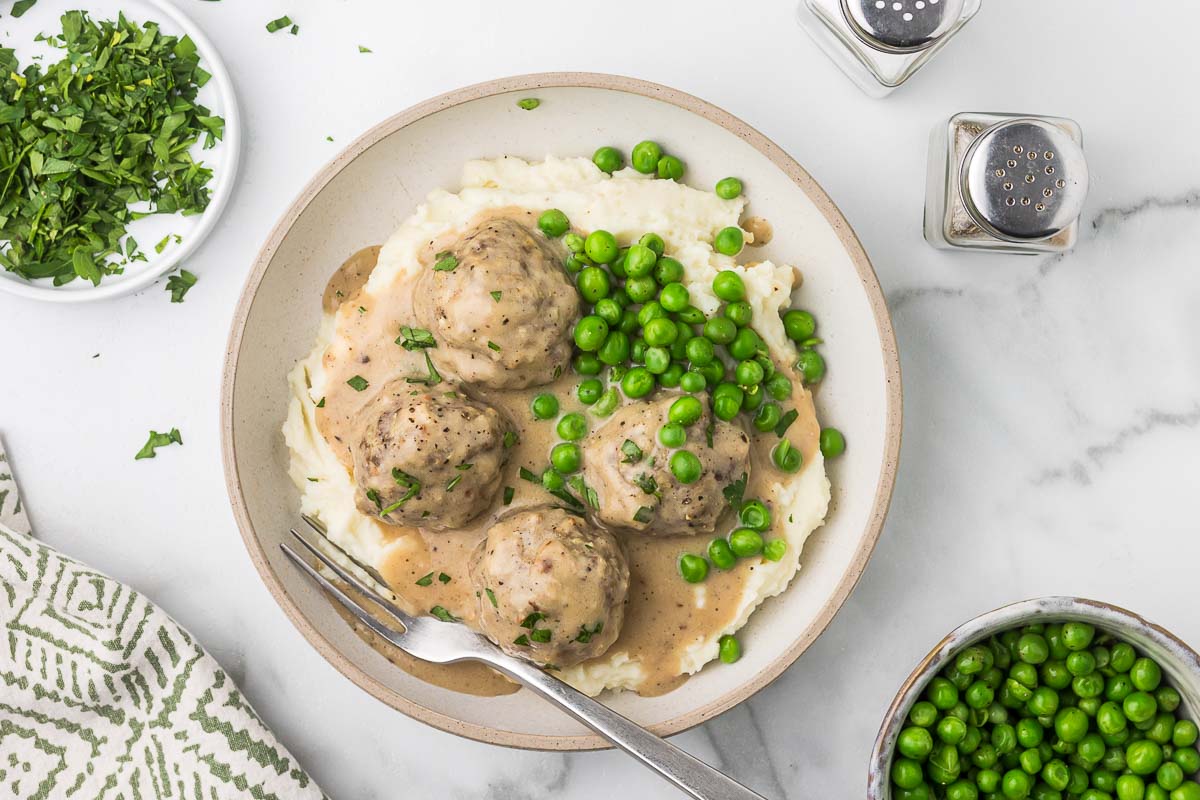 Swedish Meatballs with mashed potatoes and peas.